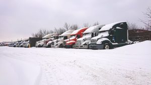 row of trucks in snow