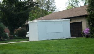 white mobile storage unit in driveway